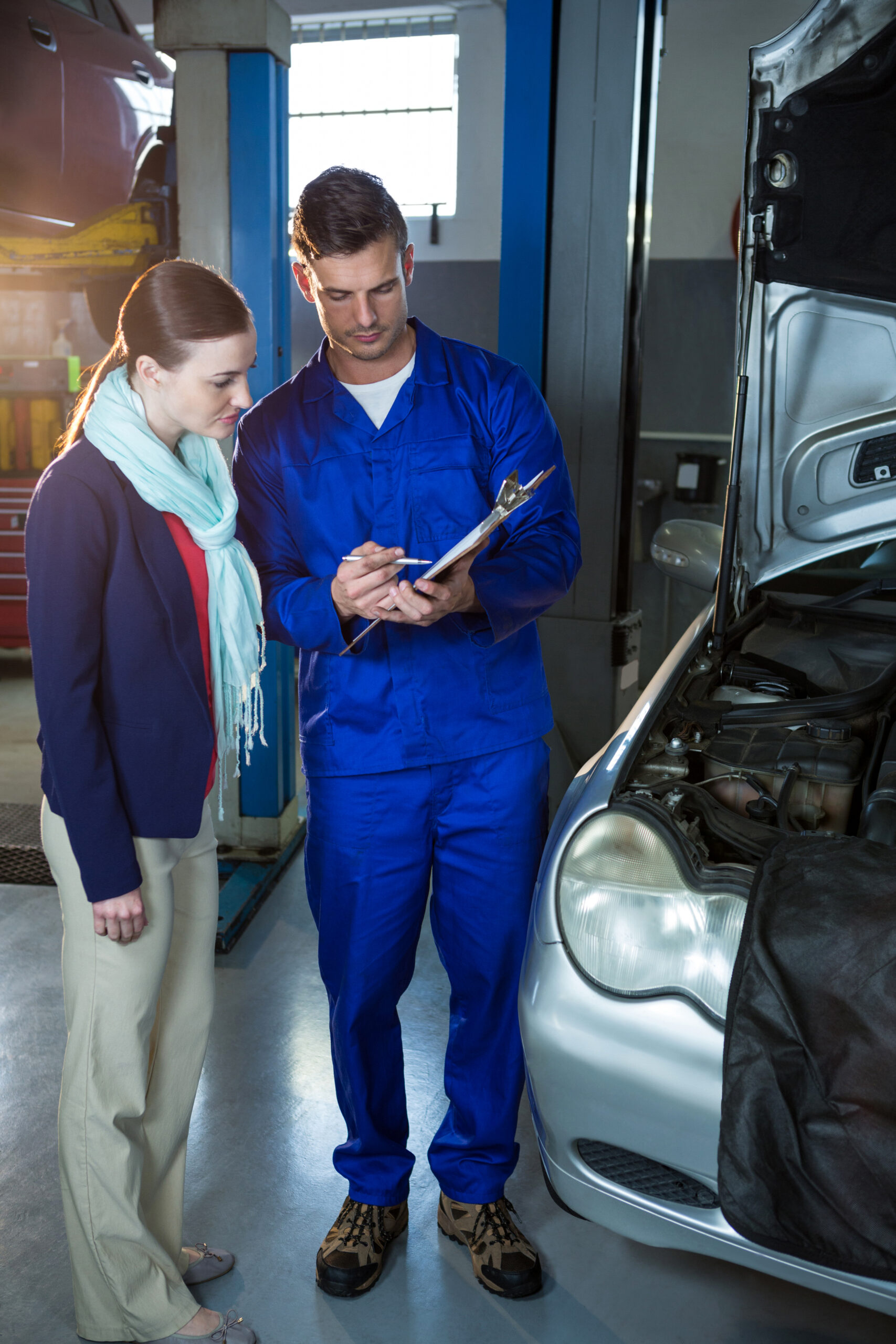 Mechanic explaining quotation to a customer